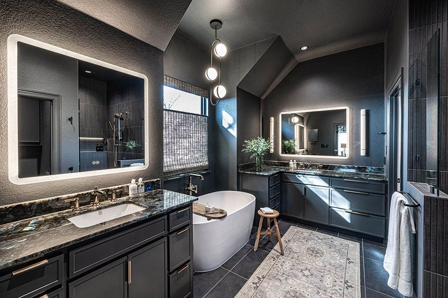 Stunning bathroom remodel in deep grey tones.