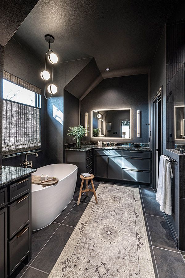 Inviting dark tones bathroom remodeling by DRI Construction